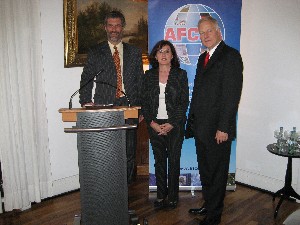 Ursula Mogg, Bundestag Defense Committee (c); Wolfgang Taubert, chapter member (l); and Brig. Gen. Reimar Scherz, GE Army (Ret.), AFCEA International board member (r), welcome attendees at the June event. 